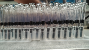 Semi-Automatic-Pre-fill-Syringe-Machine-Nested-Pre-fill-Syringes-With-Bagged-Stoppers-HMPL-Sterile-Sample-Products-