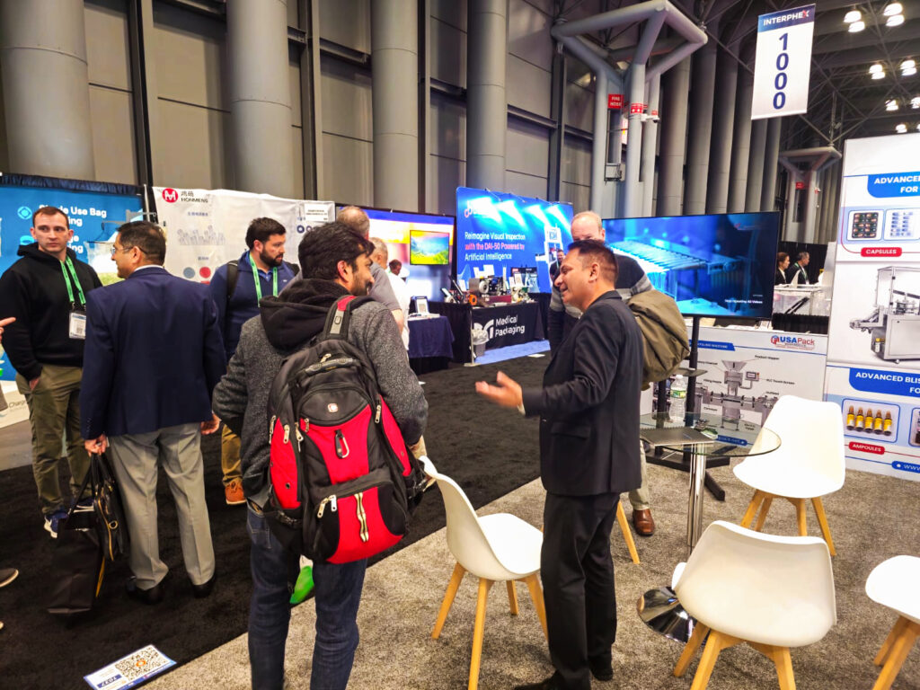 Mr Vishal Upadhyay - Director - Marketing of USA Pack Machines LLC discuss with Visitors